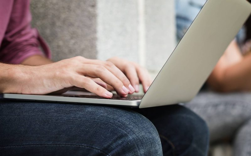 person gaming on a laptop